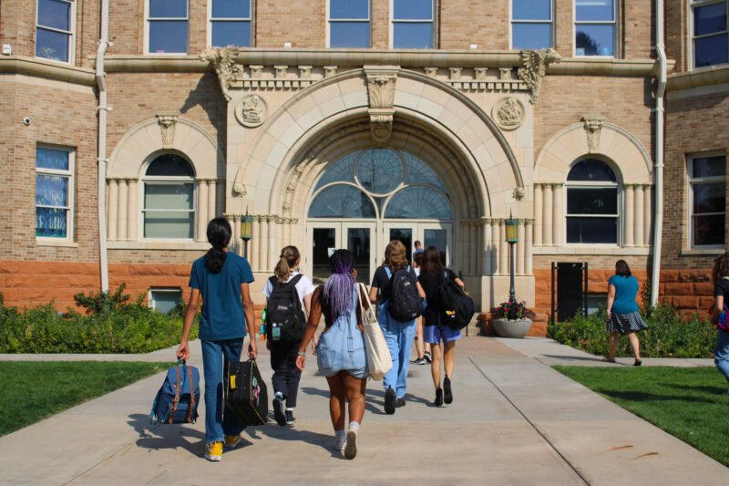 Students entering Mosaic Community Campus front door