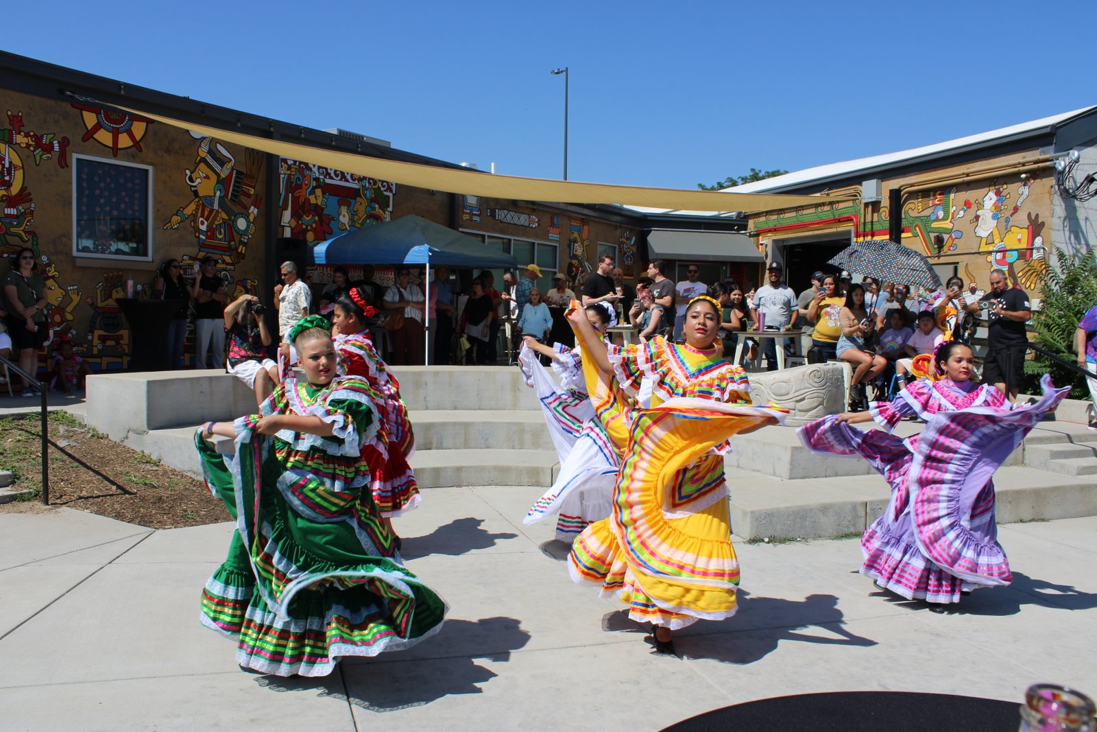 dancers in colorful dresses