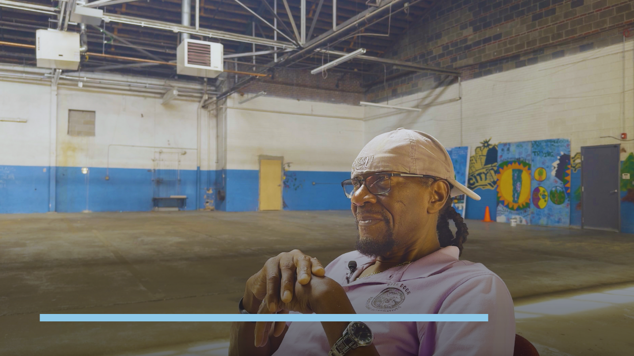 Reverend Leon Kelly sits inside the Tramway Nonprofit Center in Denver, reflecting on decades of youth mentorship in the Cole neighborhood.